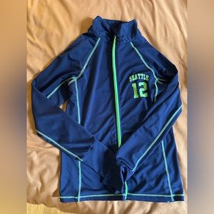 Seahawks Women’s Zip Up with thumb holes.